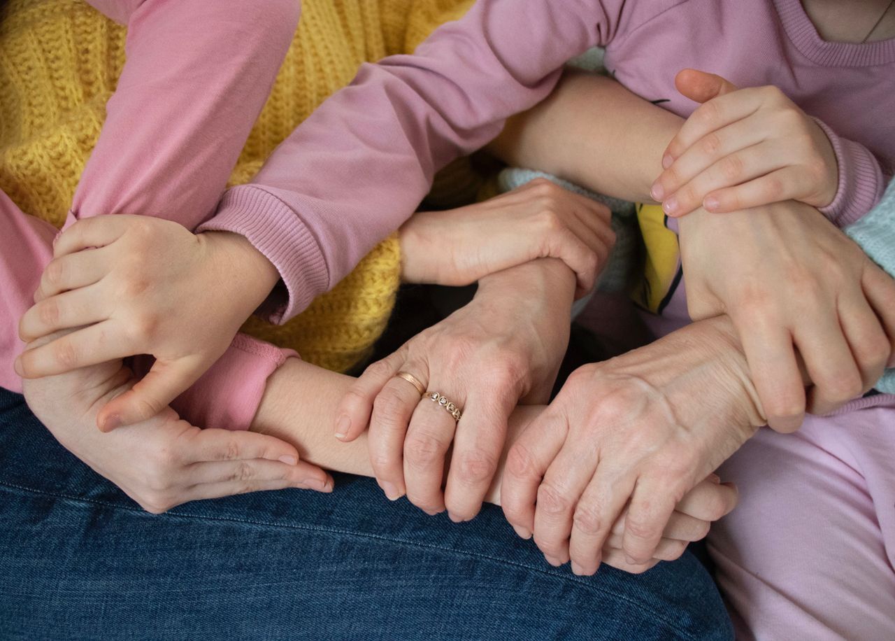 services-03 Multiple arms intertwined, symbolizing family unity and support across generations.